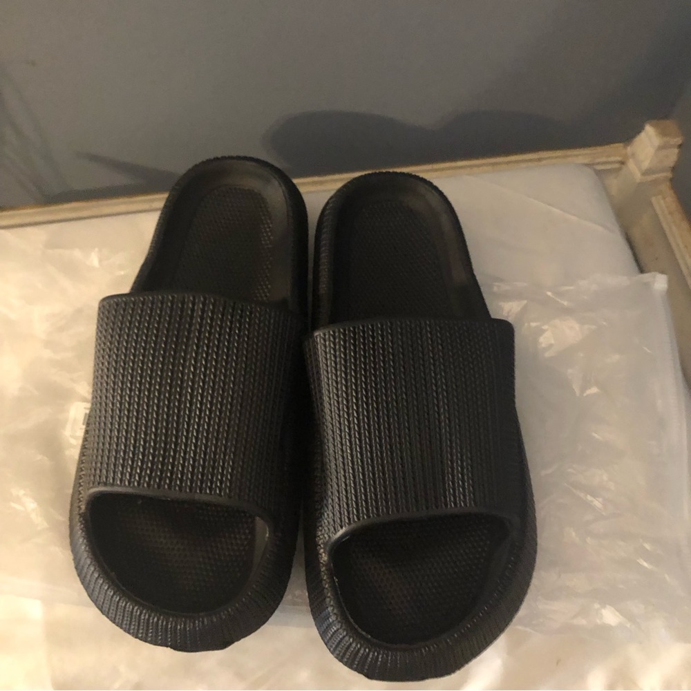 Slid Sandals Black New in Bag Size 10. They are very comfy.